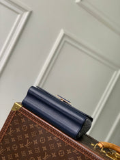 TWIST SLIM 19 IN NAVY BLUE TAURILLON CALFSKIN GOLD HARDWARE