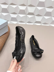 PRADA 26S ROUND TOE FLATS WITH BOW IN BLACK CALFSKIN