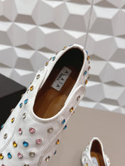 ALAIA 26S EMBELLISHED FLATS IN WHITE LAMBSKIN