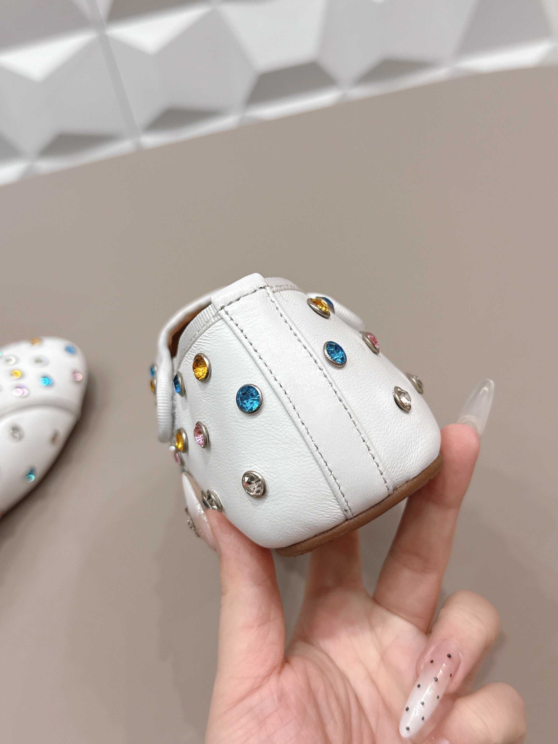 ALAIA 26S EMBELLISHED FLATS IN WHITE LAMBSKIN