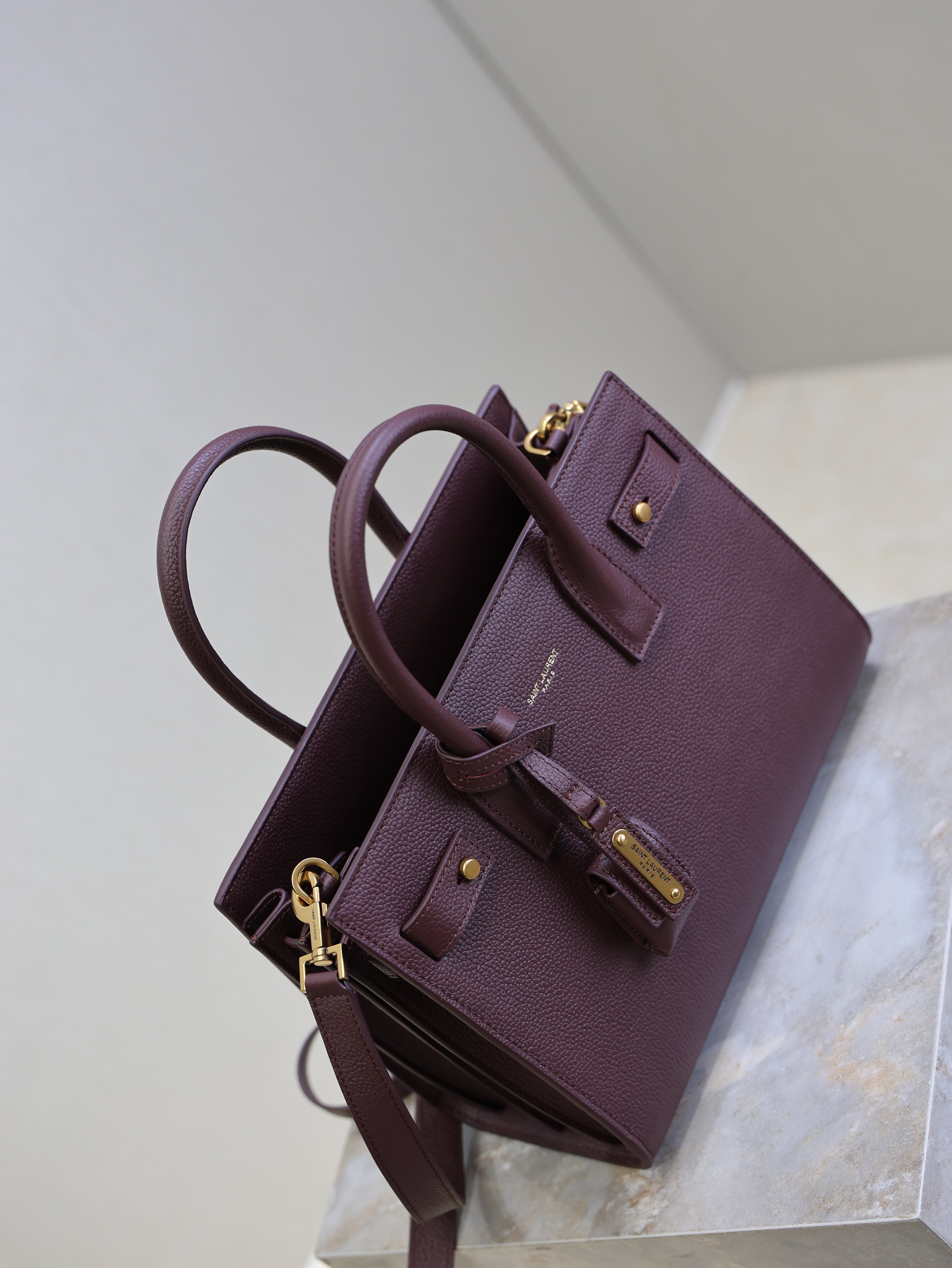 YSL 25S SAC DE JOUR MM 26 IN ROUGE CABERNET SUPPLE GRAINED CALFSKIN