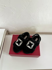 SLIDY VIV' WINTER FUR STRASS BUCKLE SANDALS IN BLACK SHEARLING
