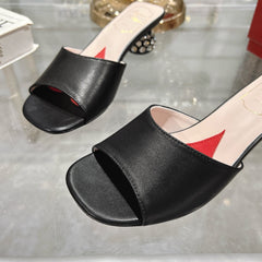 CRYSTAL HEEL MULE IN BLACK CALFSKIN