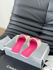 WOVEN SLIDE IN RAFFIA AND BRIGHT PINK LAMBSKIN