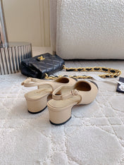 SLINGBACKS IN BEIGE CREAM MIX BLACK SHEEPSKIN