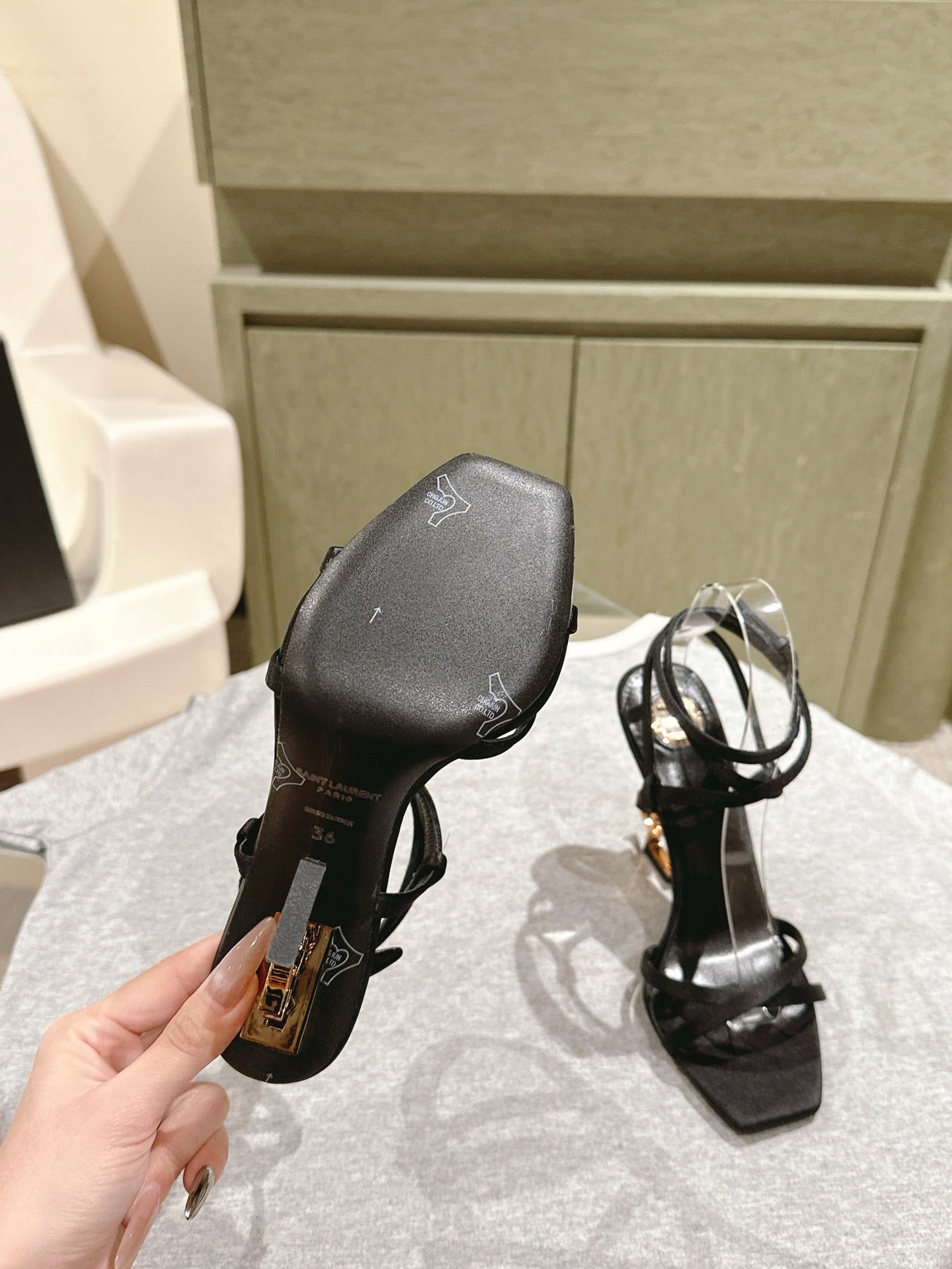 YSL 25S HIGH-HEEL SANDALS 100 MM IN BLACK SATIN WITH YSL LOGO HEEL DESIGN IN GOLD