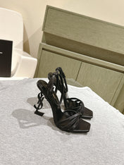 YSL 25S HIGH-HEEL SANDALS 100 MM IN BLACK LAMBSKIN WITH YSL LOGO HEEL DESIGN