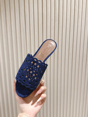 ALAIA PERFORATED SLIDE SANDALS 25S IN NAVY BLUE SUEDE
