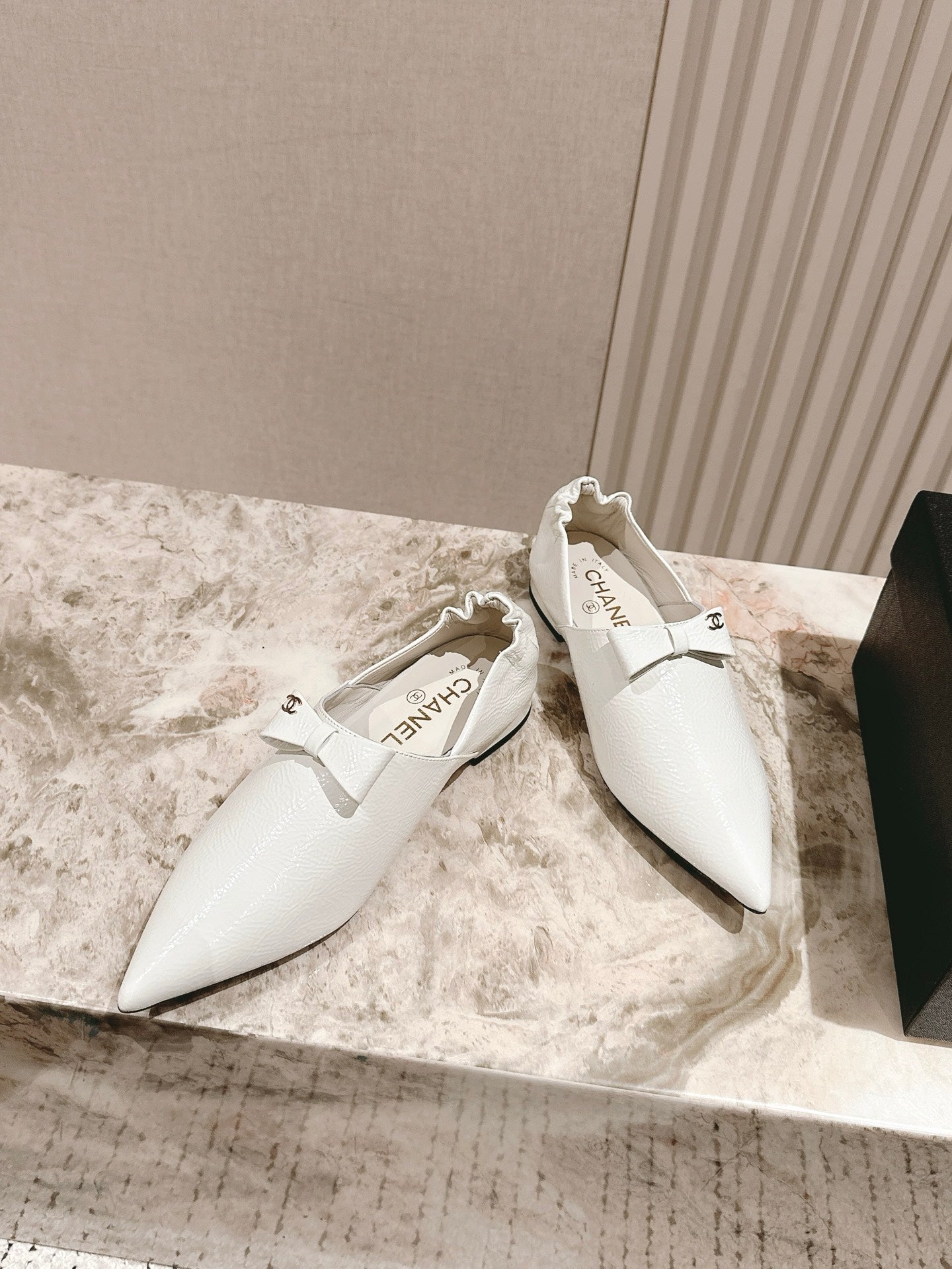 CC FLATS 25S IN WHITE PATENT LEATHER