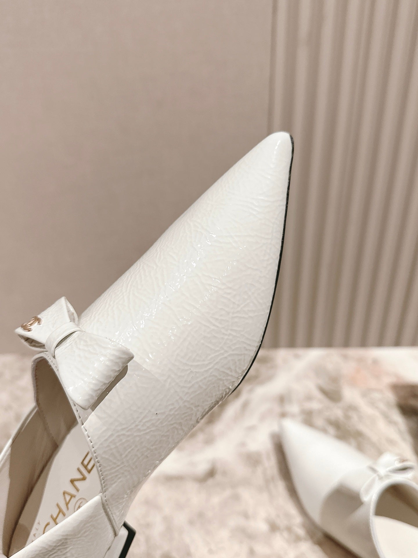 CC FLATS 25S IN WHITE PATENT LEATHER