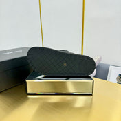 THICK-SOLED SLIDE IN BLACK LAMBSKIN AND WOOL LINING