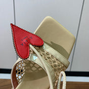ALAIA BANQUET WEDGE SANDALS IN GOLD LAMBSKIN WITH RED HEART