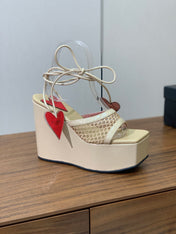 ALAIA BANQUET WEDGE SANDALS IN GOLD LAMBSKIN WITH RED HEART