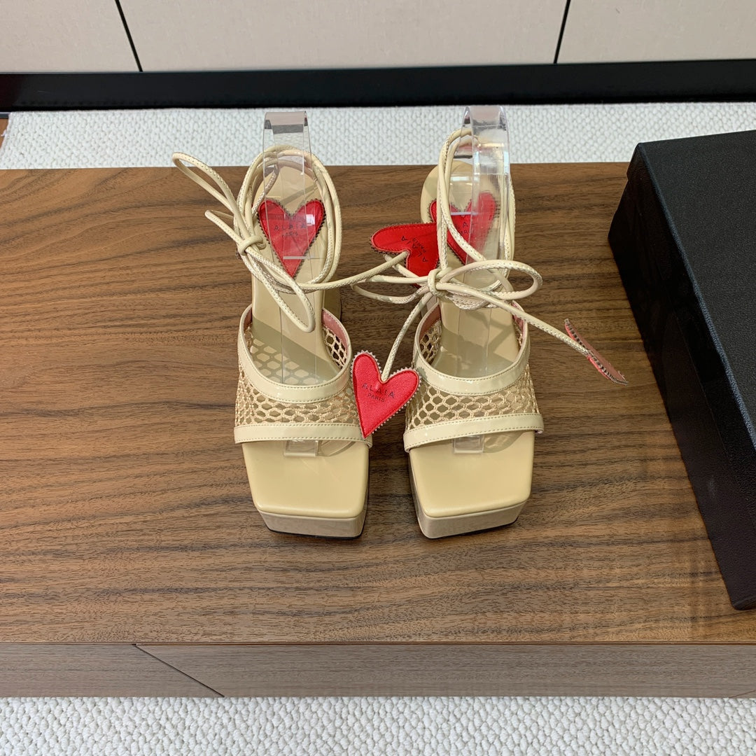 ALAIA BANQUET WEDGE SANDALS IN GOLD LAMBSKIN WITH RED HEART