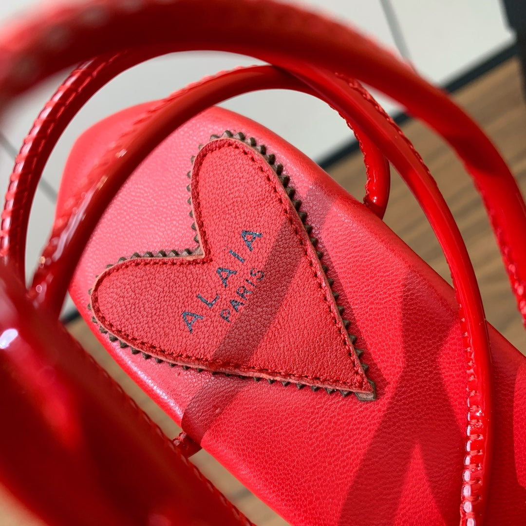 ALAIA BANQUET WEDGE SANDALS IN CHERRY RED LAMBSKIN WITH RED HEART