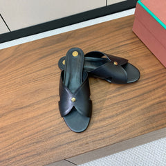 FLAT SLIPPERS IN BLACK CALFSKIN