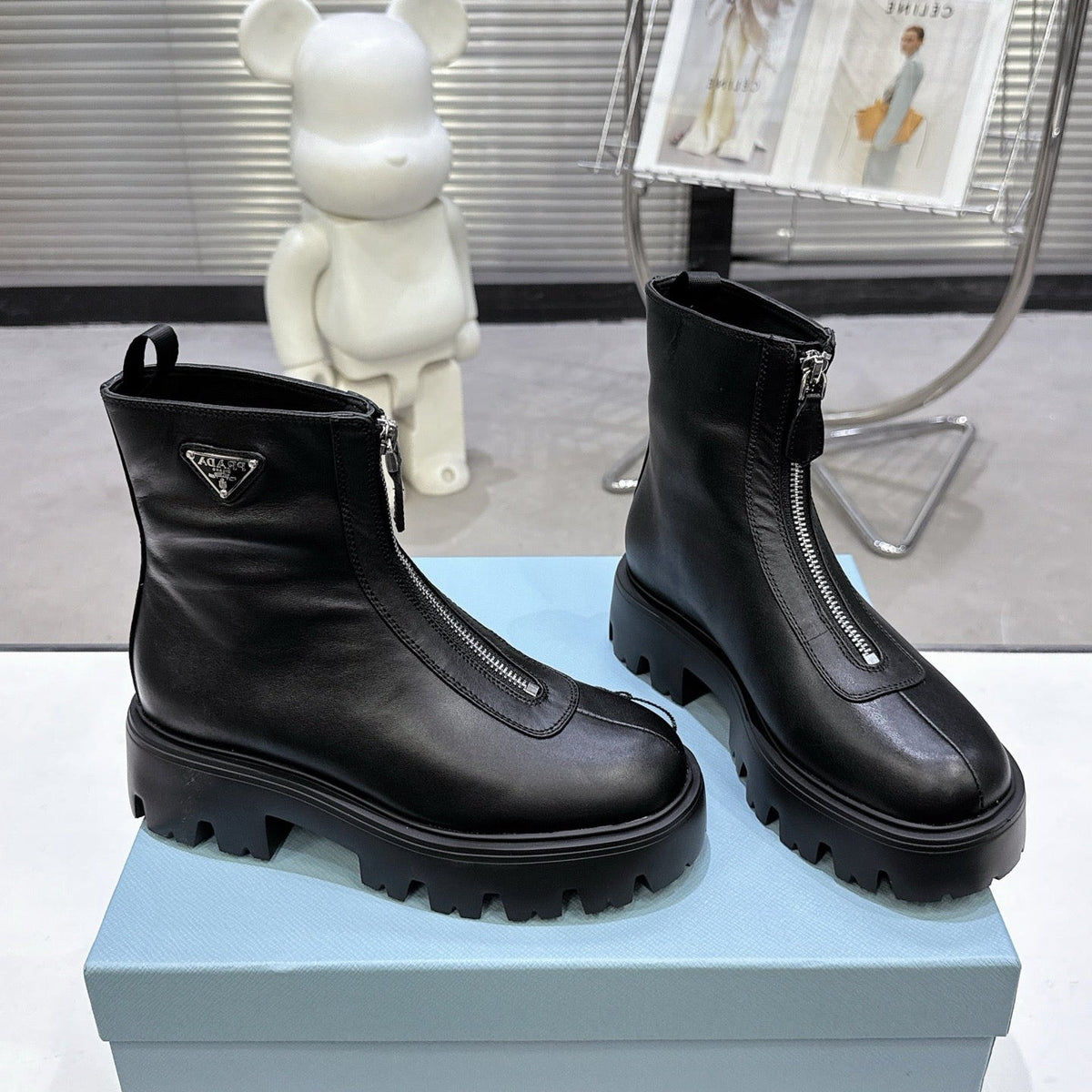 PRADA 25S ZIP-UP ANKLE BOOTS IN BLACK CALFSKIN