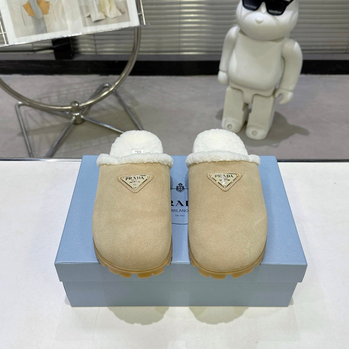 PRADA 25S FUR-LINED MULES IN BEIGE SUEDE