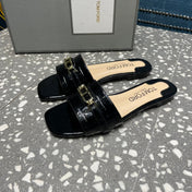 FLAT MULE IN BLACK CALFSKIN