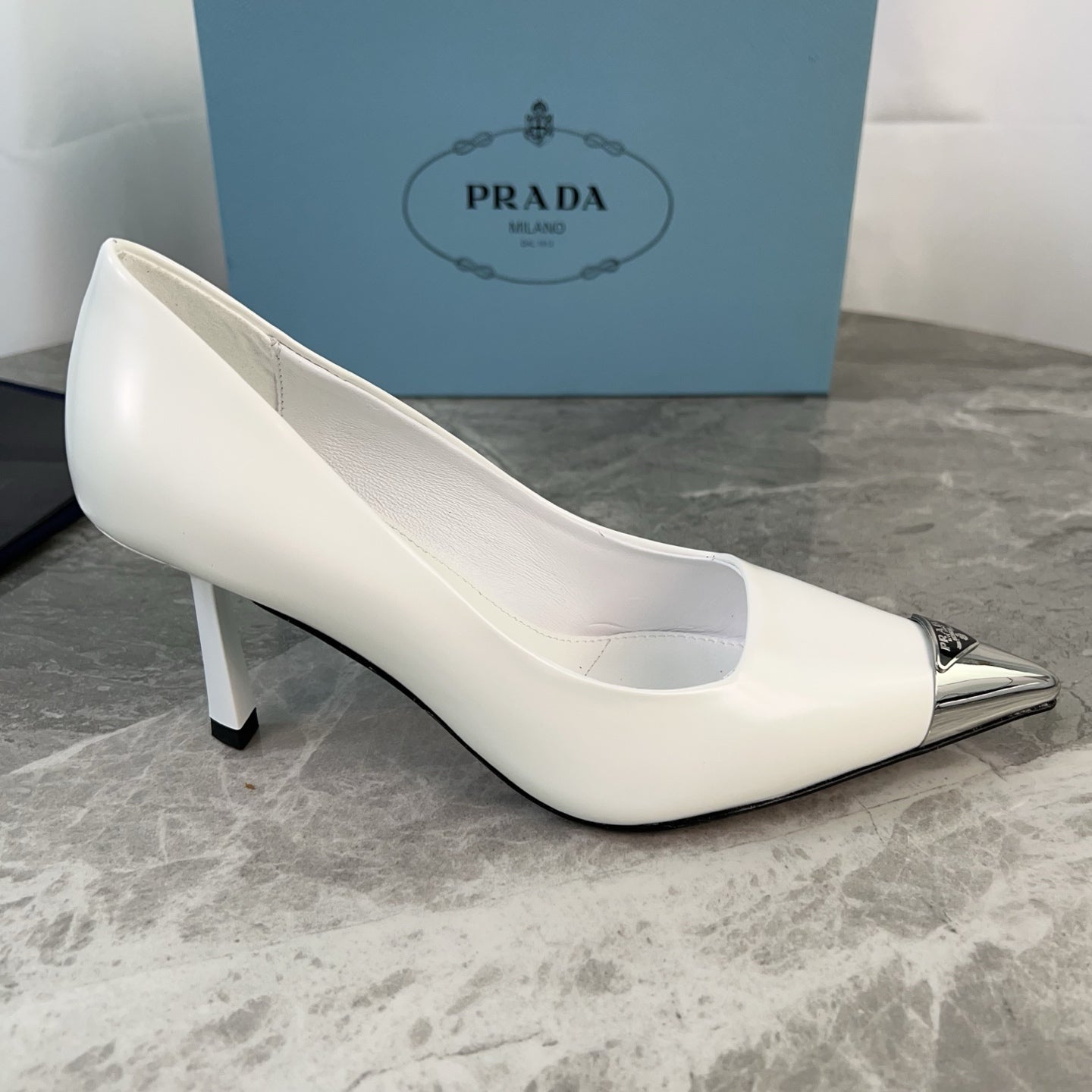 PRADA 25S METAL-CAPPED POINTED-TOE HIGH HEELS IN WHITE CALFSKIN