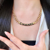 CHANEL 26S CHANEL BLACK LETTER LOGO CHAIN NECKLACE IN GOLD METAL 630061