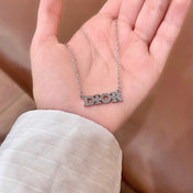 CD 26S PAVE LOGO LETTER NECKLACE IN SILVER TONE METAL 631805