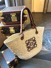 LOE SMALL ANAGRAM BASKET 28 BAG IN NATURAL MIX BROWN IRACA PALM AND CALFSKIN