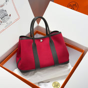 GARDEN PARTY 30CM IN RED TOILETS COTTON CANVAS AND DARK BROWN CALFSKIN PINK ON SIDE OTHER