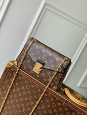 TRUNKIE 27 IN BROWN COATED CANVAS BLACK CALFSKIN SIGNATURE S-LOCK