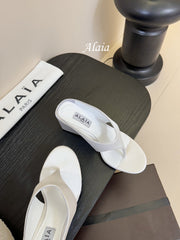 ALAIA WEDGE THONG SANDALS 25S IN WHITE SATIN