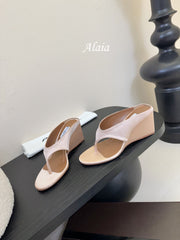 ALAIA WEDGE THONG SANDALS 25S IN BLUSH BEIGE SATIN