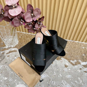 ALAIA ELASTIC CAGE MULE SANDALS IN BLACK WOVEN STRAP AND LAMBSKIN