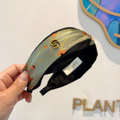 HAIRBAND WITH FLOWER PRINT IN MOSS GREEN SILK 398865