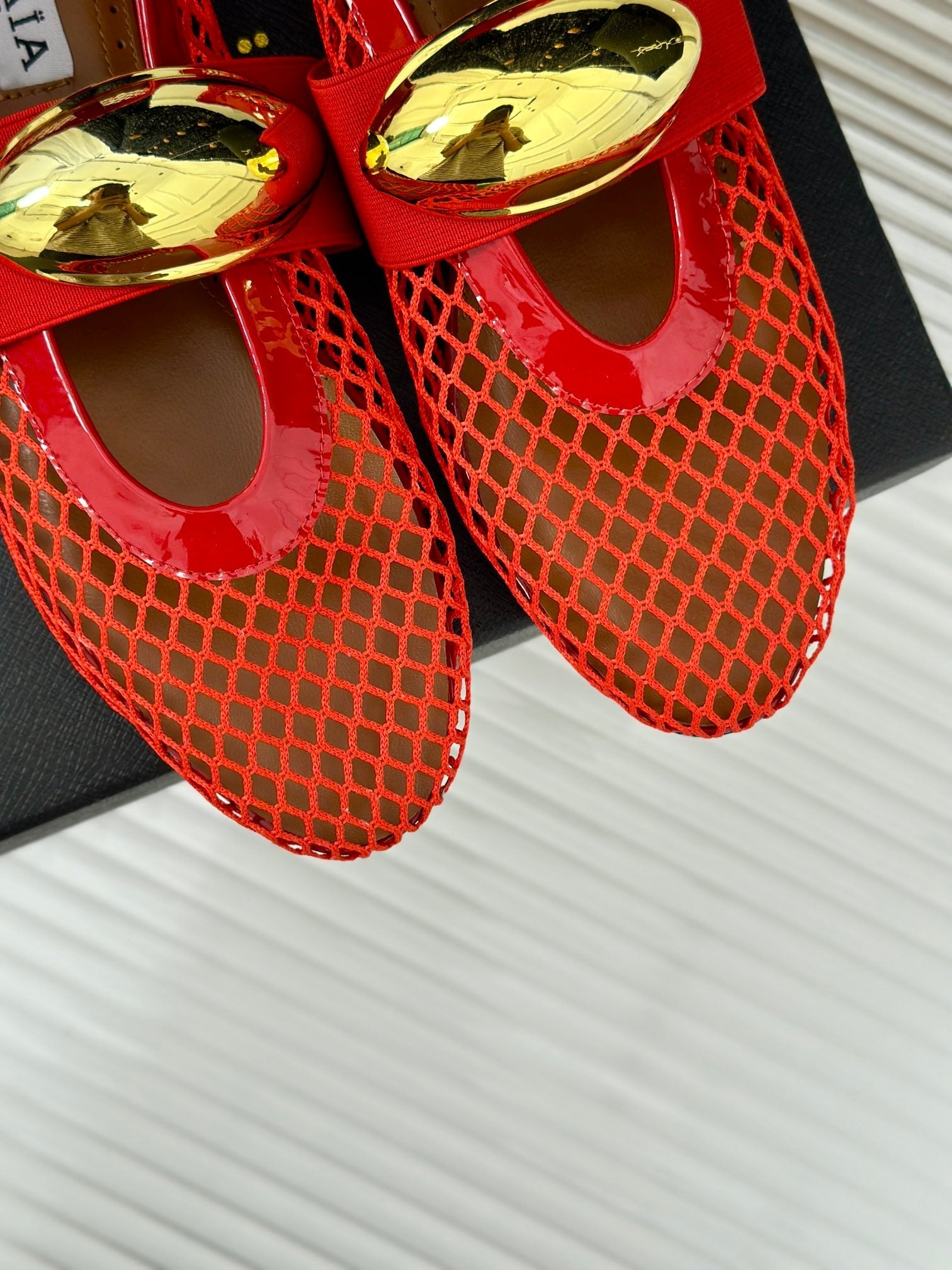 ALAIA MARY JANE SHOES IN CHERRY RED MESH WITH GOLD HARDWARE