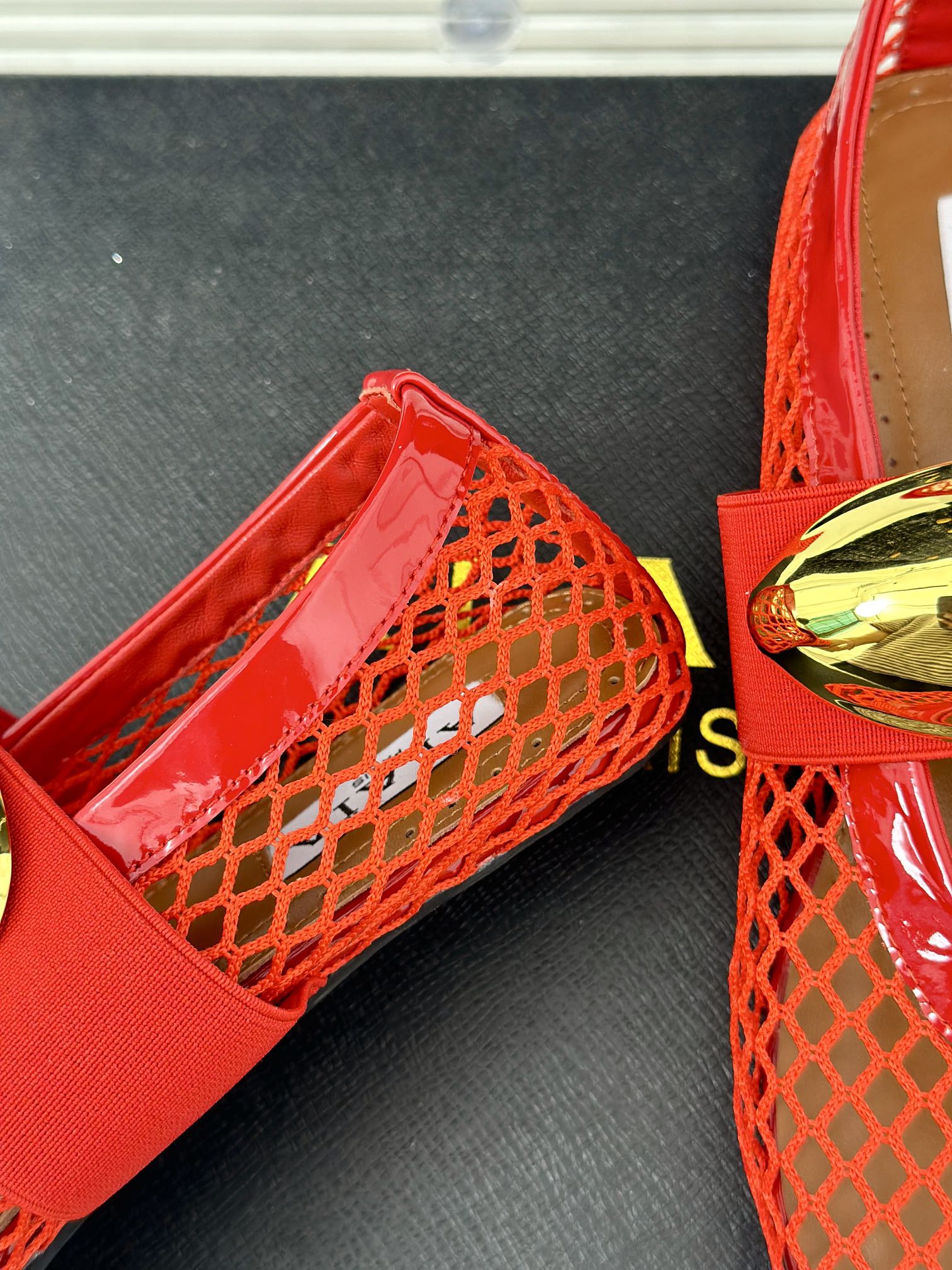 ALAIA MARY JANE SHOES IN CHERRY RED MESH WITH GOLD HARDWARE