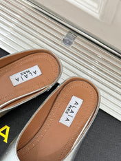 ALAIA FLAT MULE IN SILVER LAMBSKIN