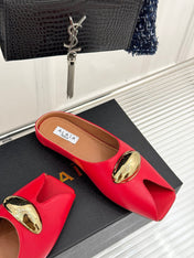 ALAIA FLAT MULE IN CRIMSON RED LAMBSKIN WITH GOLD HARDWARE