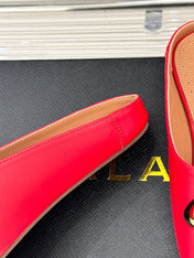 ALAIA FLAT MULE IN CRIMSON RED LAMBSKIN WITH GOLD HARDWARE
