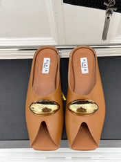 ALAIA FLAT MULE IN BRONZE BROWN LAMBSKIN WITH GOLD HARDWARE