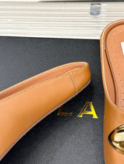 ALAIA FLAT MULE IN BRONZE BROWN LAMBSKIN WITH GOLD HARDWARE