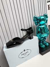 PRADA 26S ANKLE STRAP PUMPS 40MM IN BLACK PATENT CALFSKIN TRIANGLE LOGO