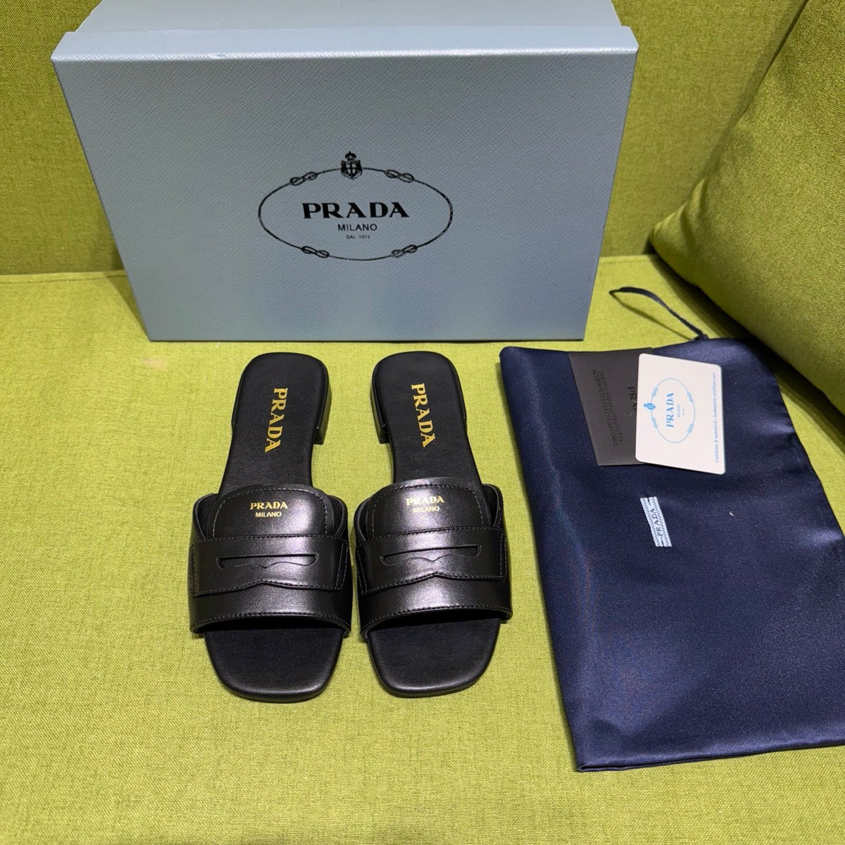 PRADA 25S SLIDES IN BLACK CALFSKIN