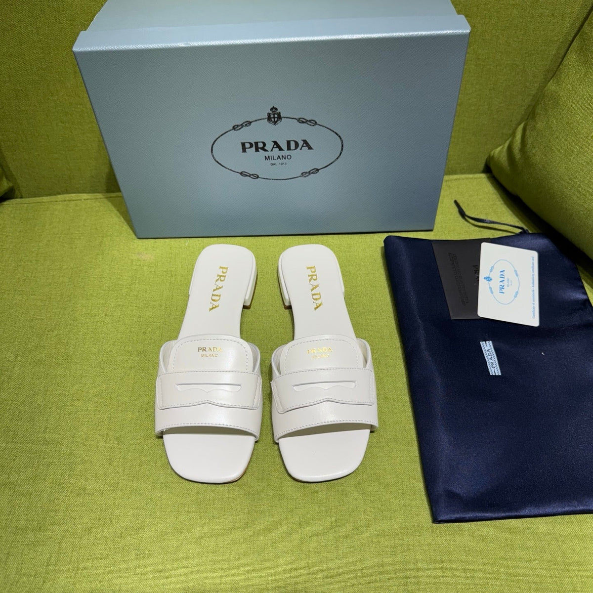 PRADA 25S SLIDES IN WHITE CALFSKIN
