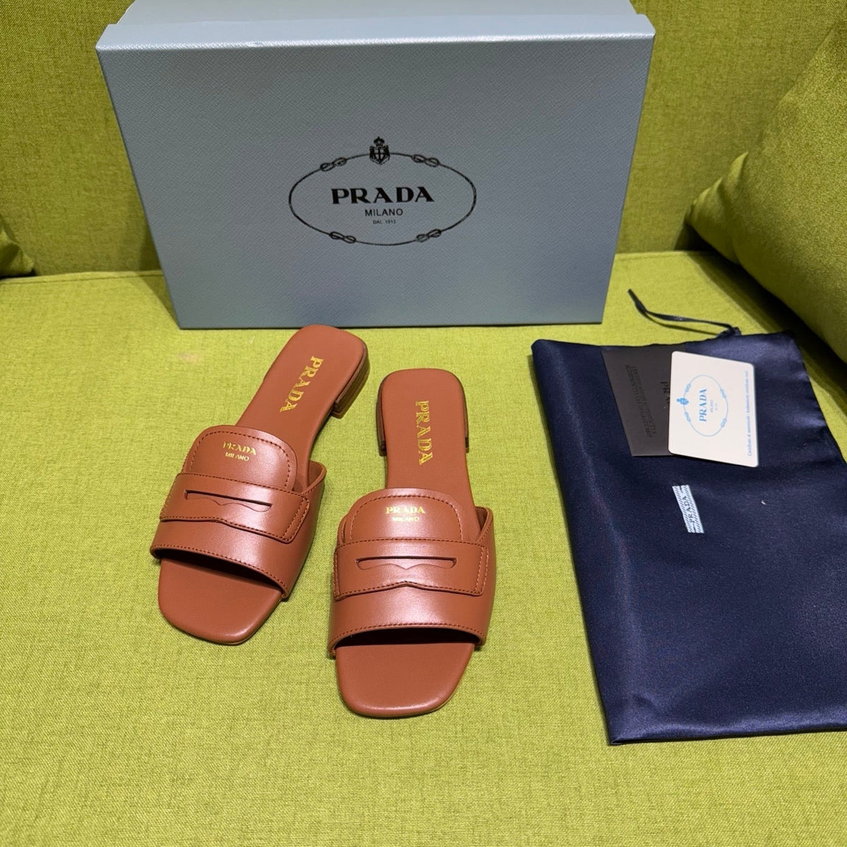 PRADA 25S SLIDES IN BROWN CALFSKIN