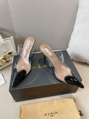 ALAIA HIGH MULES IN BLACK PATENT CALFSKIN AND FILM