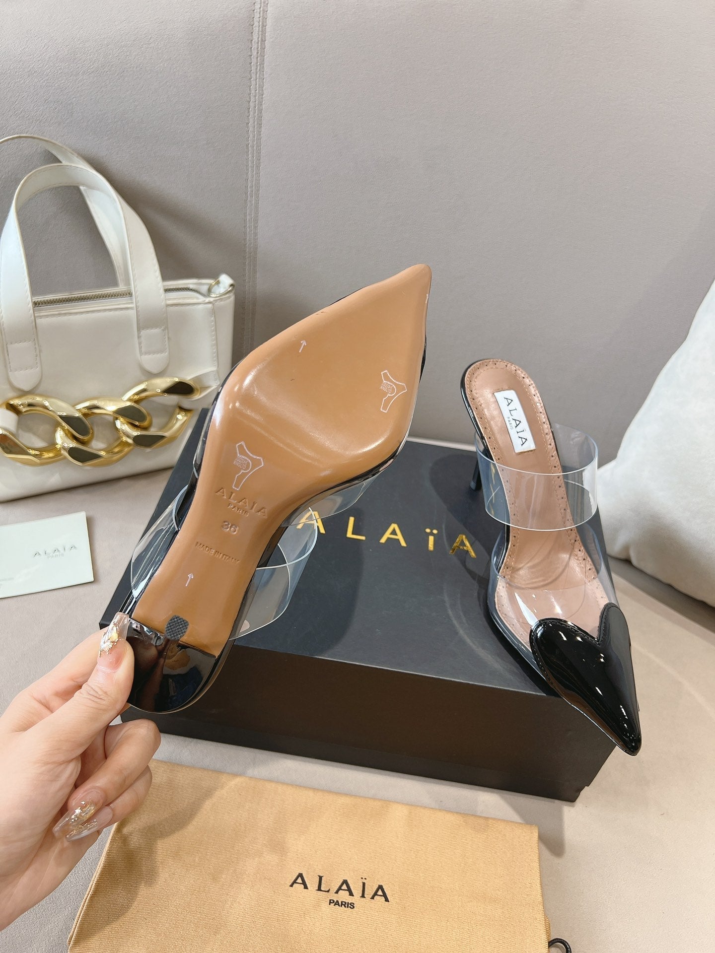 ALAIA HIGH MULES IN BLACK PATENT CALFSKIN AND FILM