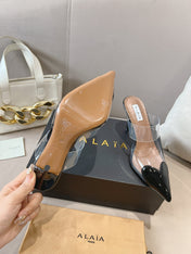 ALAIA HIGH MULES IN BLACK PATENT CALFSKIN AND FILM