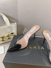 ALAIA HIGH MULES IN BLACK PATENT CALFSKIN AND FILM