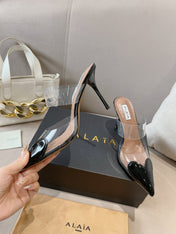 ALAIA HIGH MULES IN BLACK PATENT CALFSKIN AND FILM