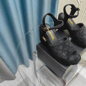 THICK-SOLED WEDGE SANDALS IN BLACK SUEDE